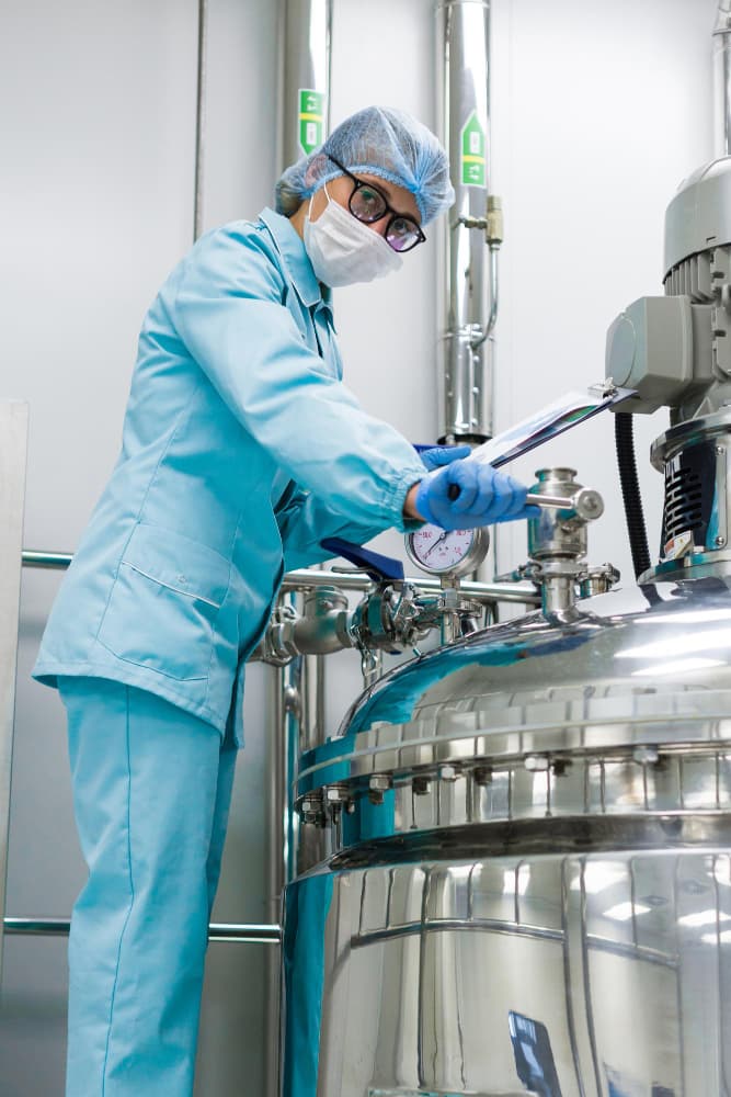 Vermont worker performing quality control on production equipment — a representative VEA placement