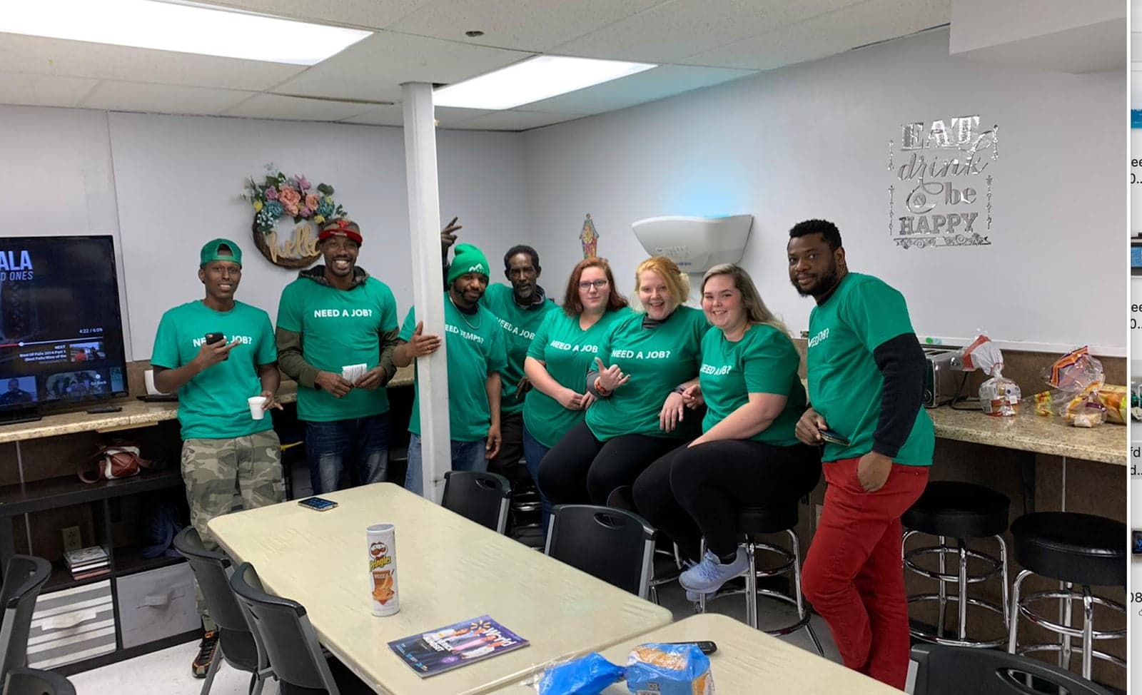 The VEA team gathered at VEA headquarters in South Burlington in green NEED A JOB shirts