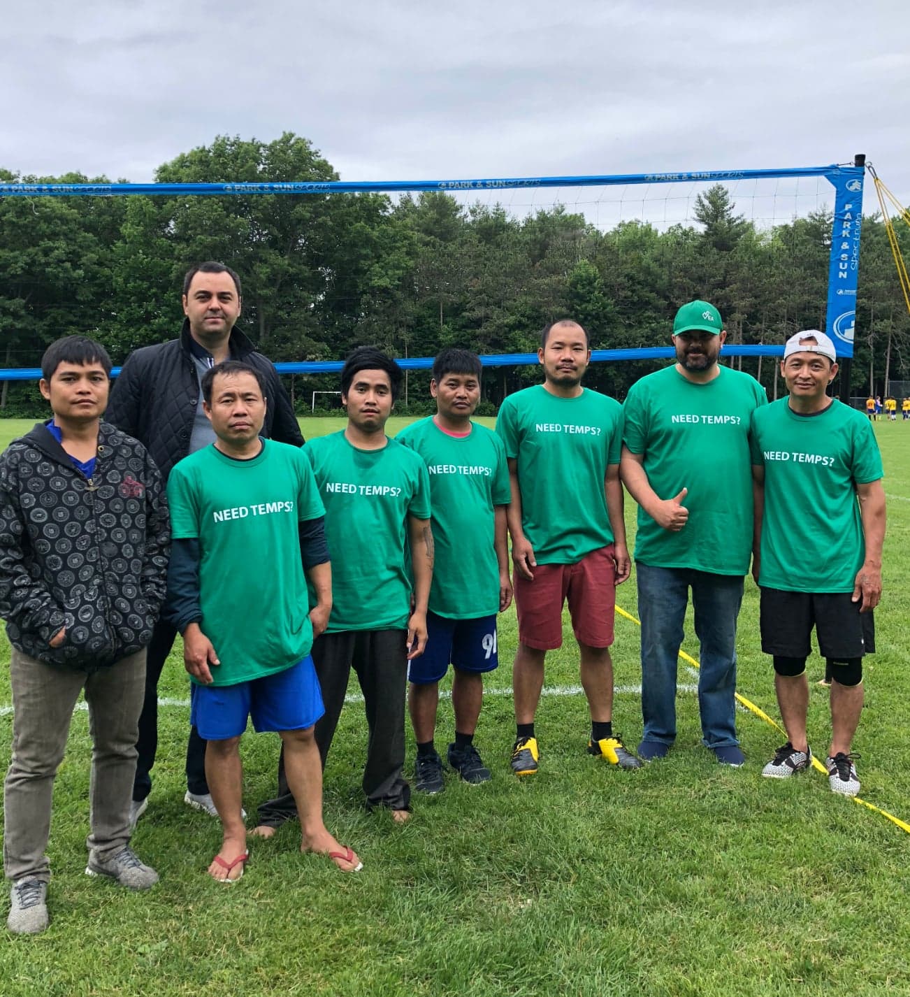 VEA team at a Vermont staff event in green NEED TEMPS shirts